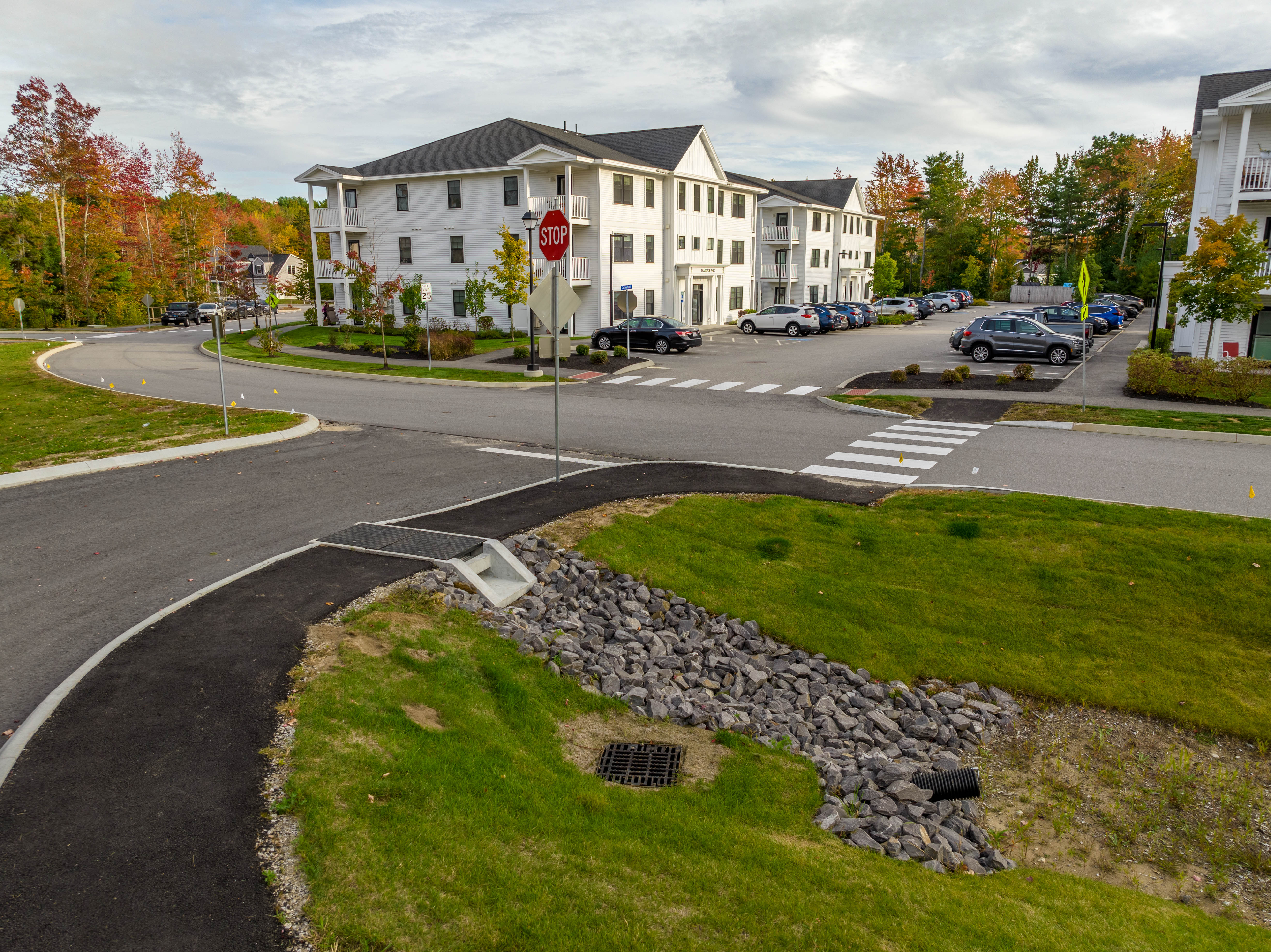 Rain Guardian Foxhole spanning a bituminous walkway near an apartment complex