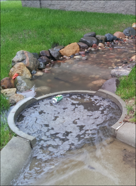 Rain Guardian Turret full of runoff with a floating soda can captured by the chamber